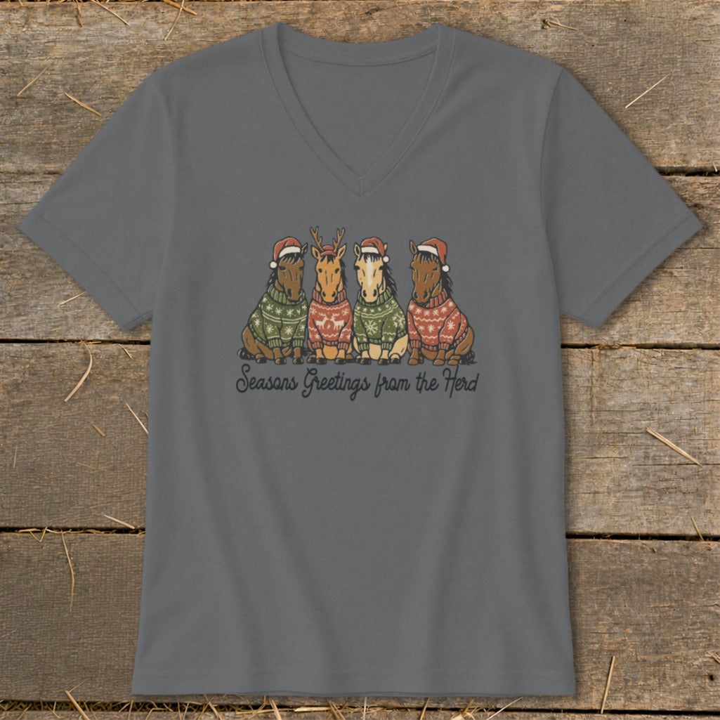 Four horses wearing Santa hats and festive sweaters, with text "Seasons Greetings from the Herd".