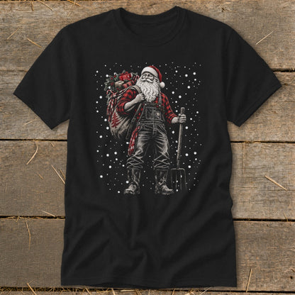 Santa in overalls and flannel carries a gift sack and pitchfork in falling snow.