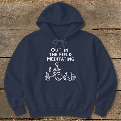 Navy hoodie with "Out in the Field Meditating" text and tractor graphic.