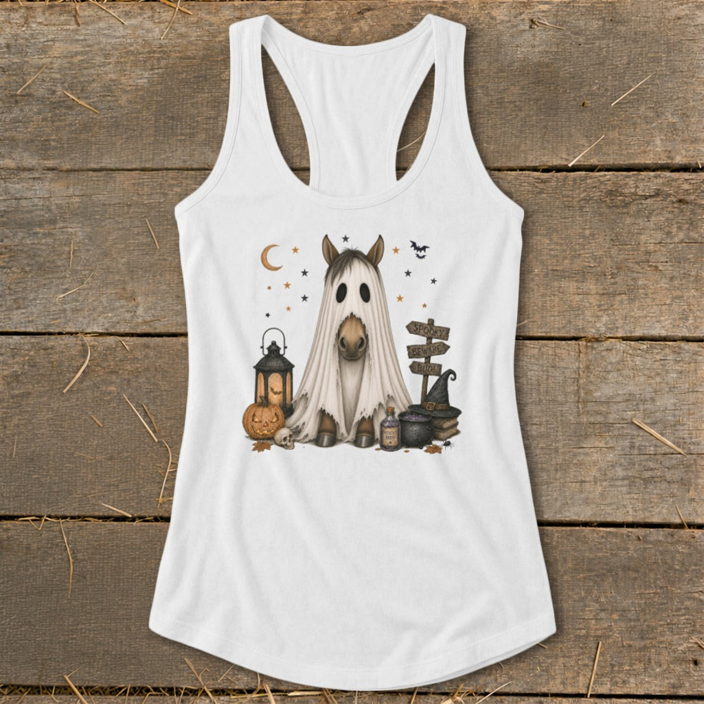 Horse in ghost costume with Halloween decor, lantern, pumpkin, and signs.