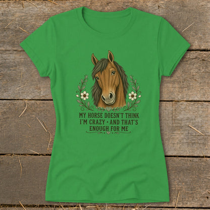 Green t-shirt with a horse head illustration and text "My horse doesn't think I'm crazy and that's enough for me".