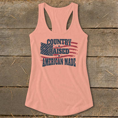 Peach tank top with distressed American flag and "COUNTRY RAISED AMERICAN MADE" text.