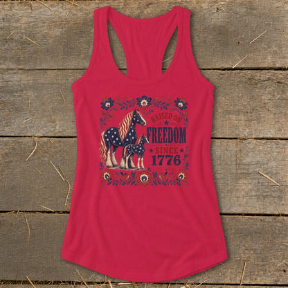 Tank top with two horses and "Raised on Freedom Since 1776" text.