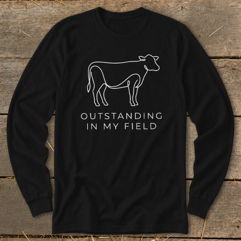 Black long-sleeve shirt with white line art of a cow and text.
