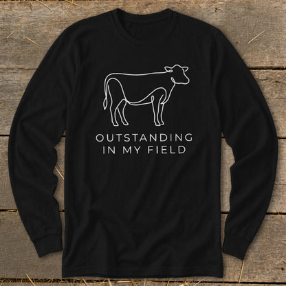 Black long-sleeve shirt with white line art of a cow and text.