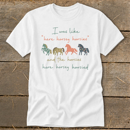 White t-shirt with text "I was like 'here horsey horsies' and the horsies here horsey horsied" and four horse graphics.
