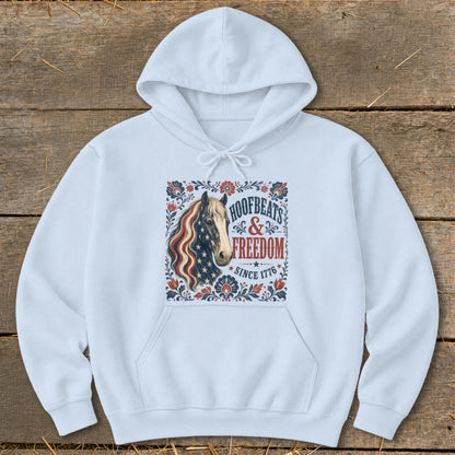 White hoodie with a horse graphic and "Hoofbeats & Freedom Since 1776" text.