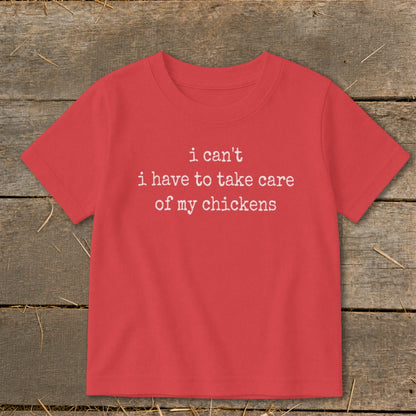 Red t-shirt with white text: "i can't i have to take care of my chickens"