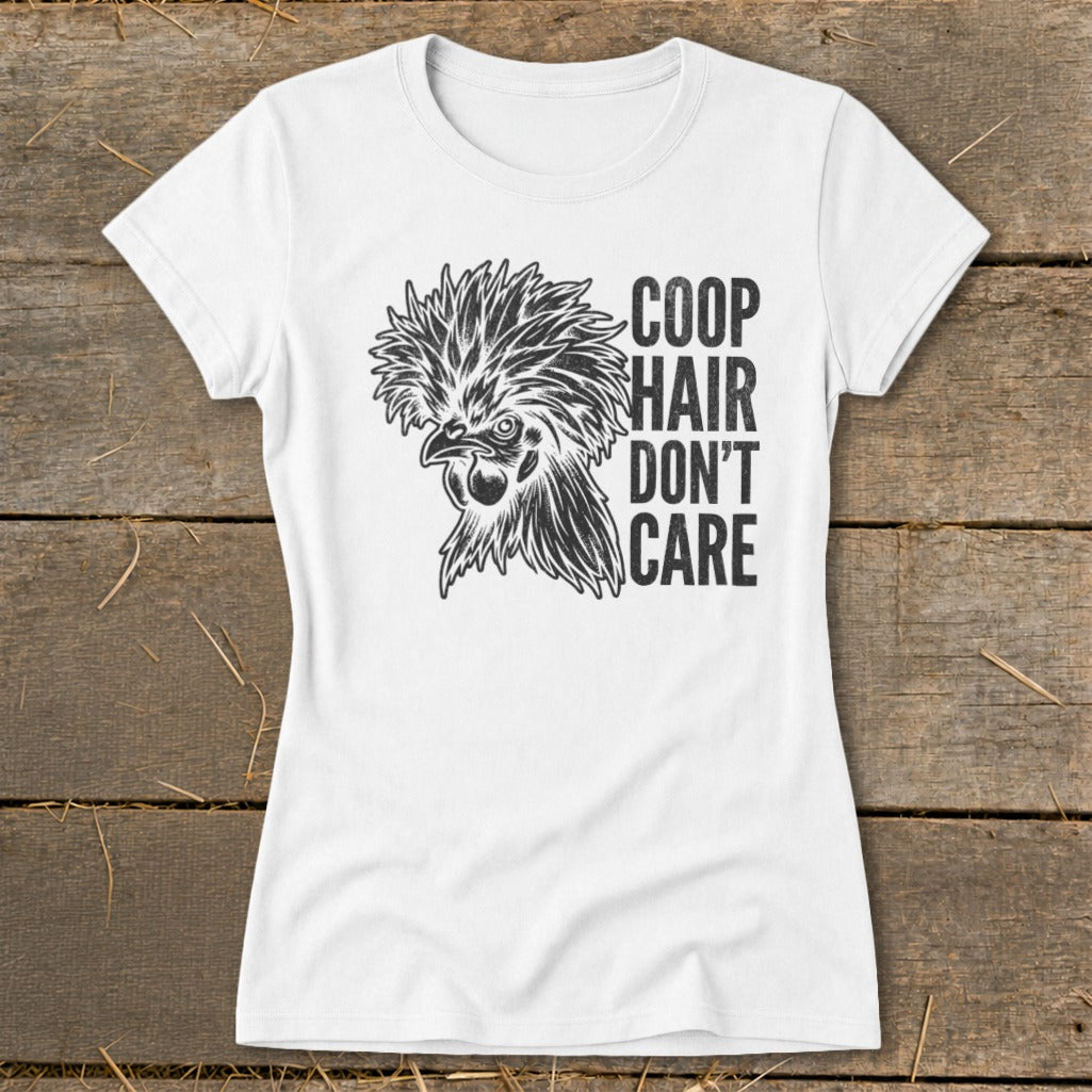 White t-shirt with a stylized drawing of a fluffy chicken and the text "COOP HAIR DON'T CARE".