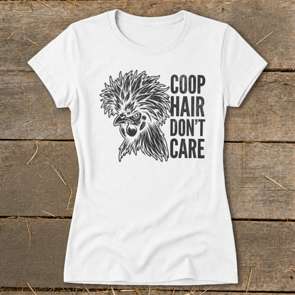 White t-shirt with a stylized drawing of a fluffy chicken and the text "COOP HAIR DON'T CARE".