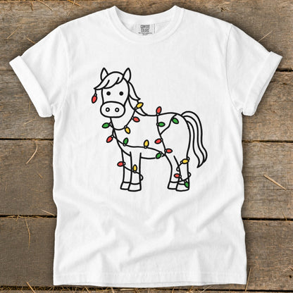 White t-shirt with a line drawing of a horse wrapped in colorful Christmas lights.