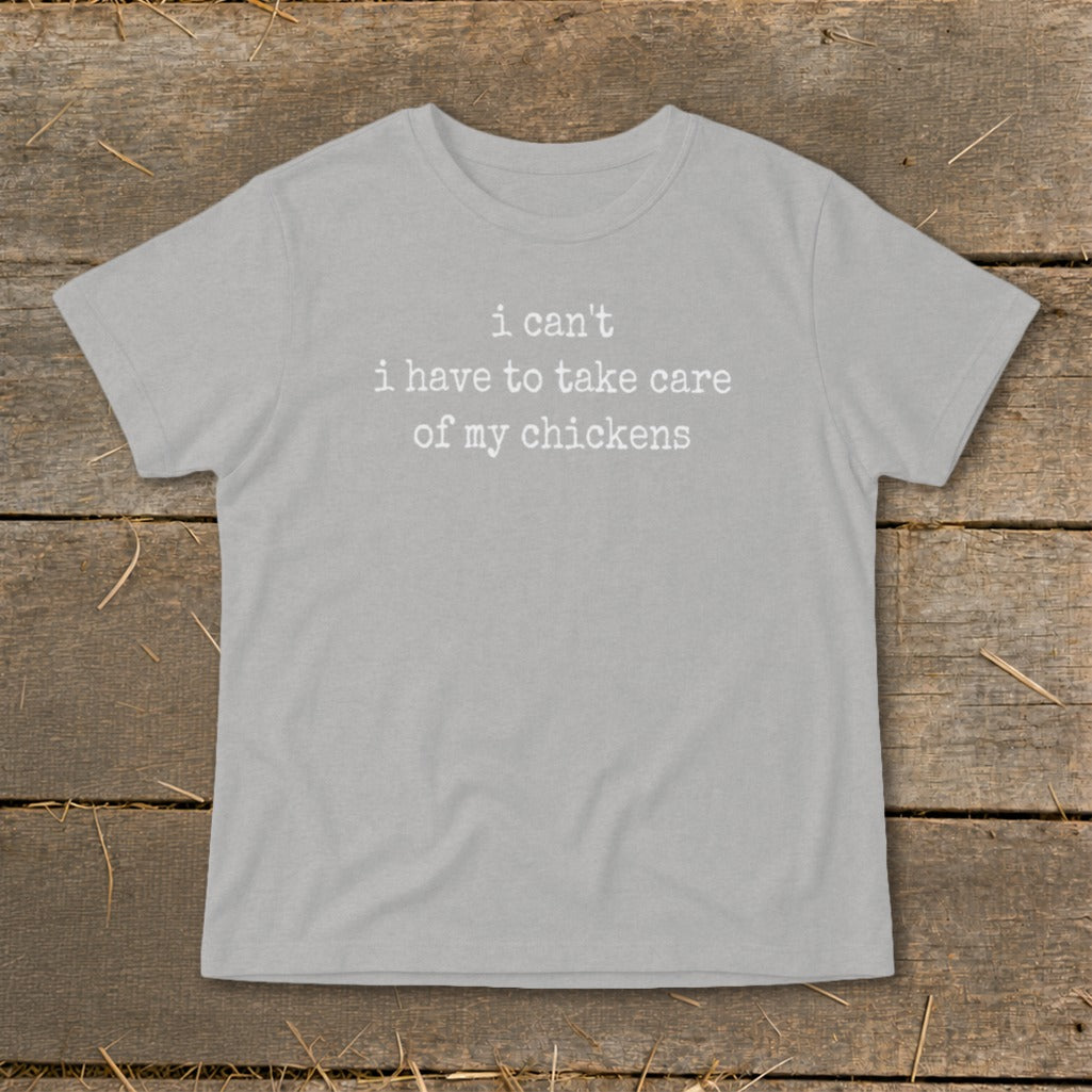 Grey t-shirt with white text "i can't i have to take care of my chickens".
