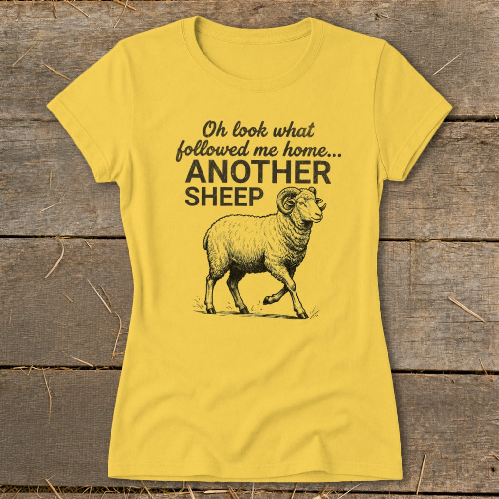 Yellow t-shirt with text "Oh look what followed me home... ANOTHER SHEEP" and a sheep illustration.