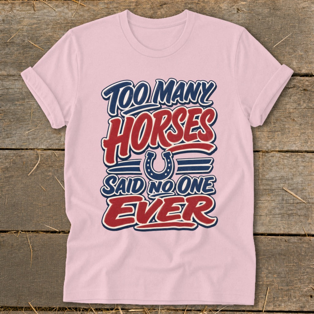 Pink t-shirt with "Too Many Horses Said No One Ever" text and horseshoe graphic.