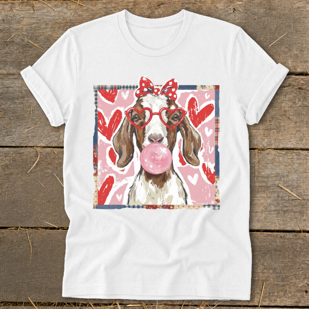 Goat with heart glasses and bubble gum on pink heart background.