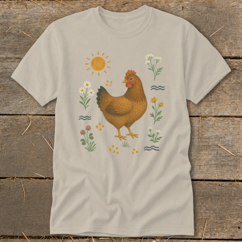 T-shirt with a brown hen surrounded by flowers, sunshine, and scattered dots.