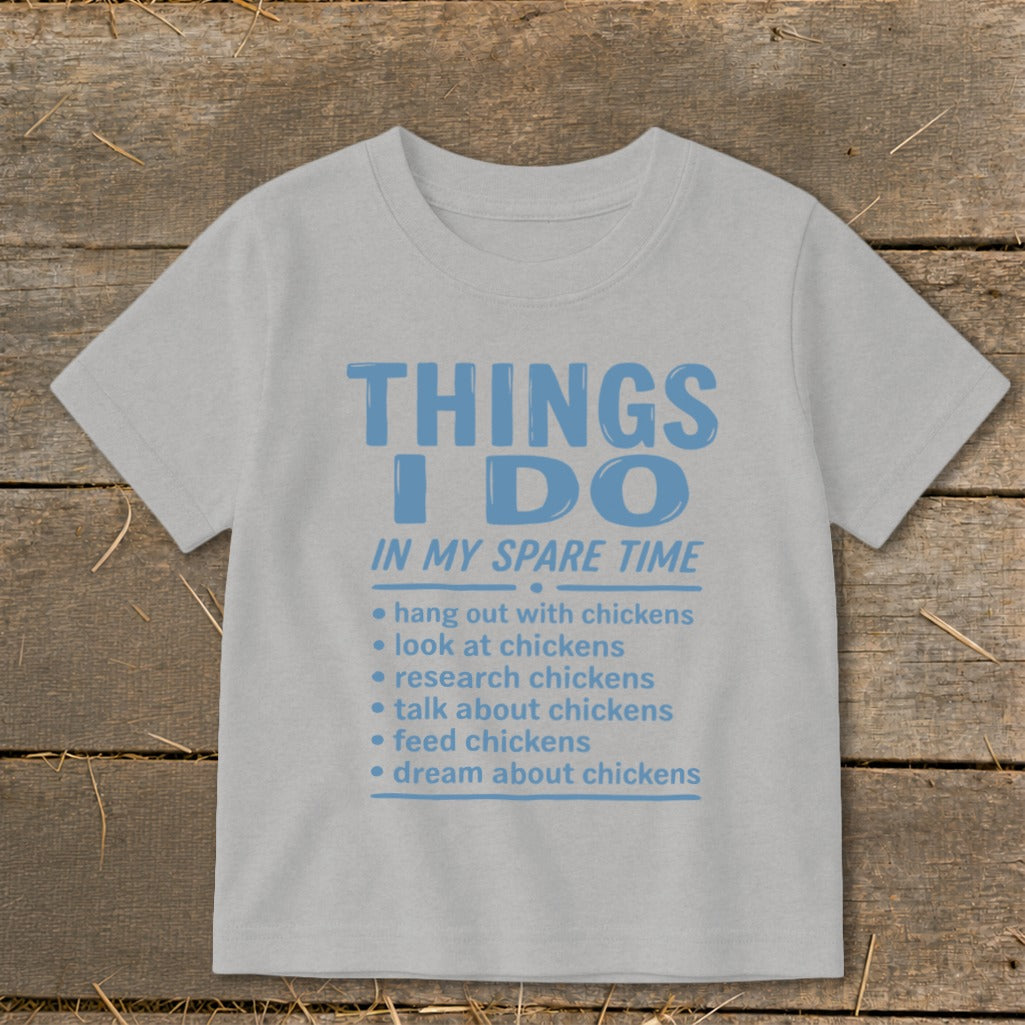 Light grey t-shirt with blue text "Things I Do In My Spare Time" and chicken-related activities.