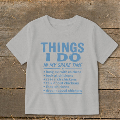 Light grey t-shirt with blue text "Things I Do In My Spare Time" and chicken-related activities.