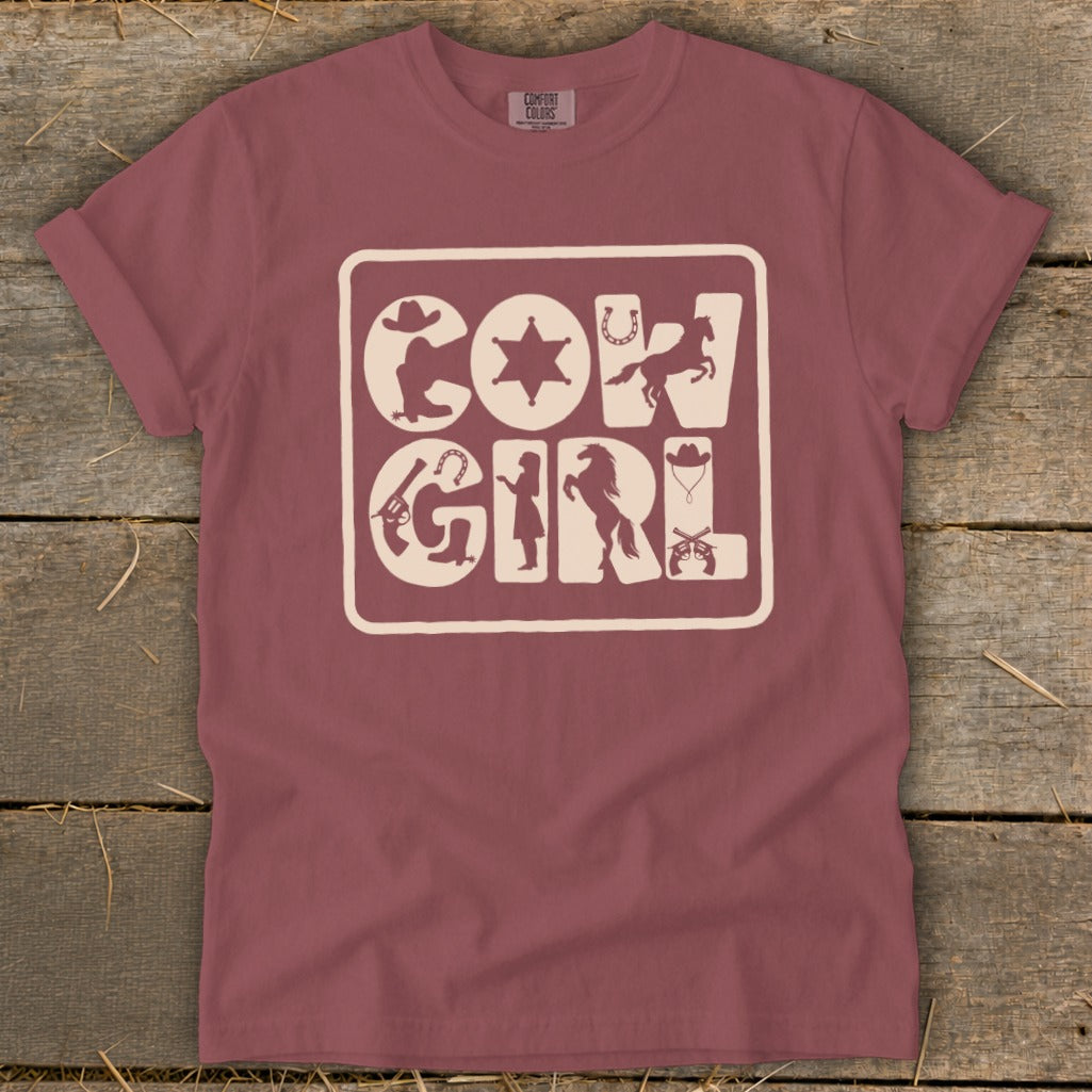 Maroon t-shirt with "COWGIRL" text composed of western icons.
