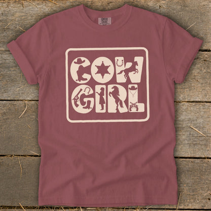 Maroon t-shirt with "COWGIRL" text composed of western icons.