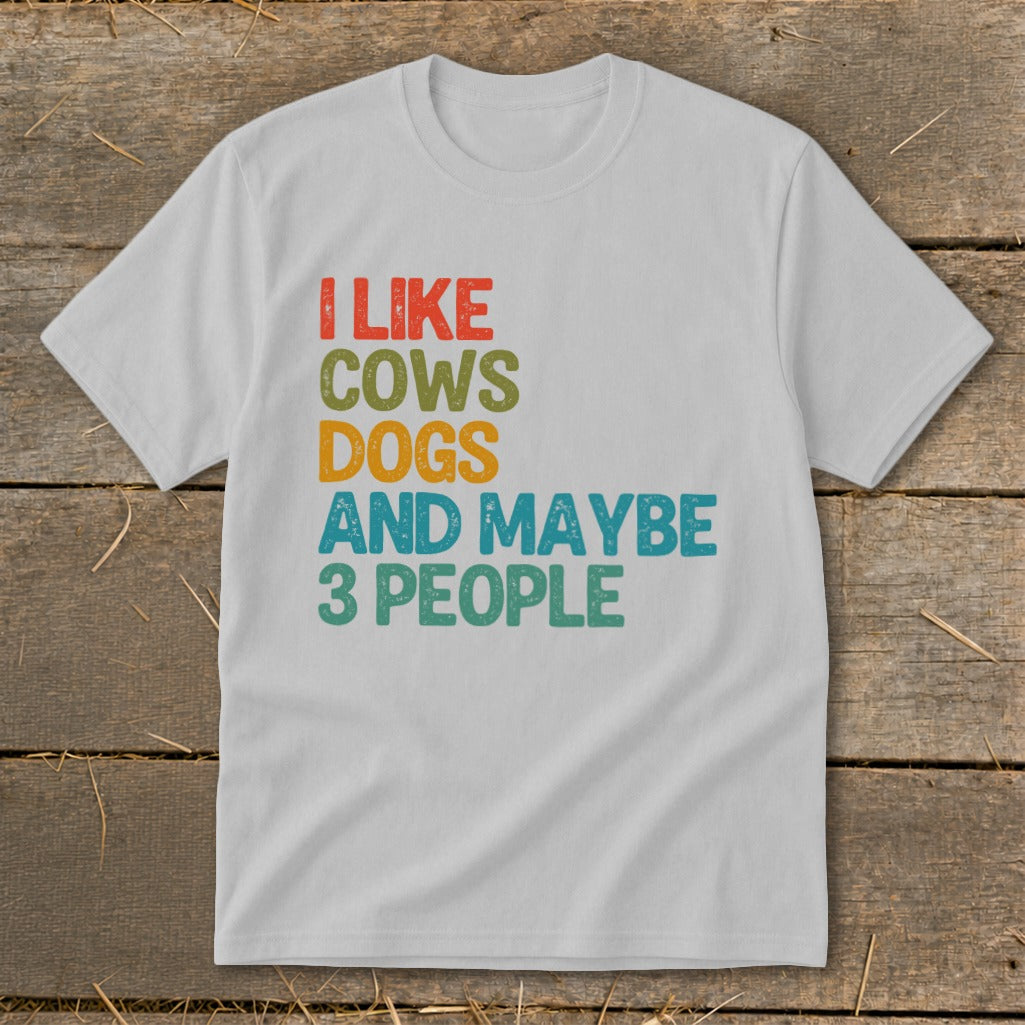White t-shirt with "I like cows, dogs, and maybe 3 people" text.