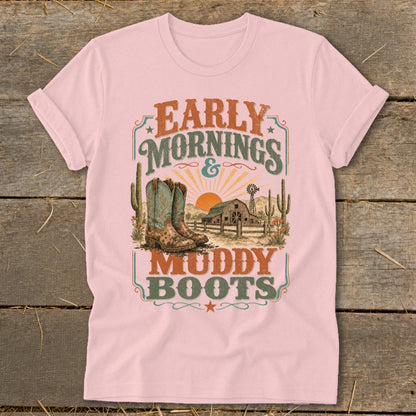 Pink t-shirt with "Early Mornings & Muddy Boots" graphic featuring cowboy boots, barn, and sunset.
