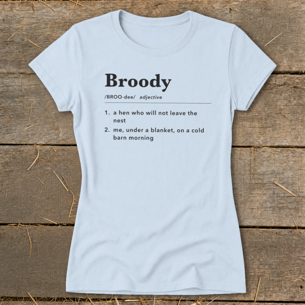 Light blue t-shirt with "Broody" definition: hen not leaving nest, or me under blanket.