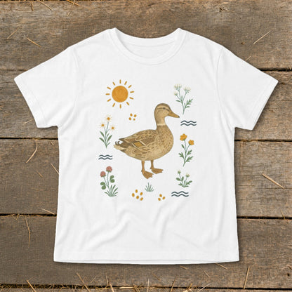 White t-shirt with a mallard duck surrounded by flowers, sun, and wavy lines.