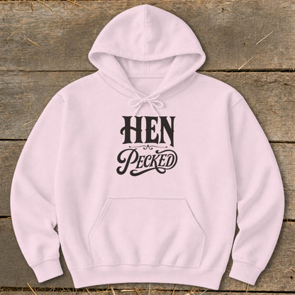 Pink hoodie with "HEN Pecked" text in black, stylized lettering.