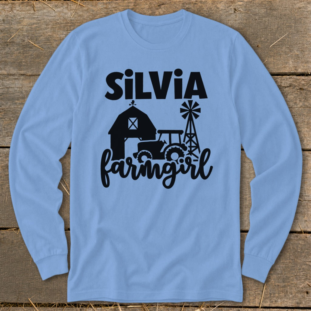 Light blue long sleeve shirt with "SILVIA farmingirl" and farm graphic.