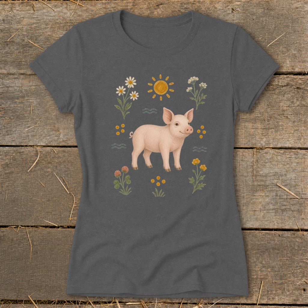 Dark grey t-shirt with a cute piglet surrounded by daisies, sun, and wildflowers.