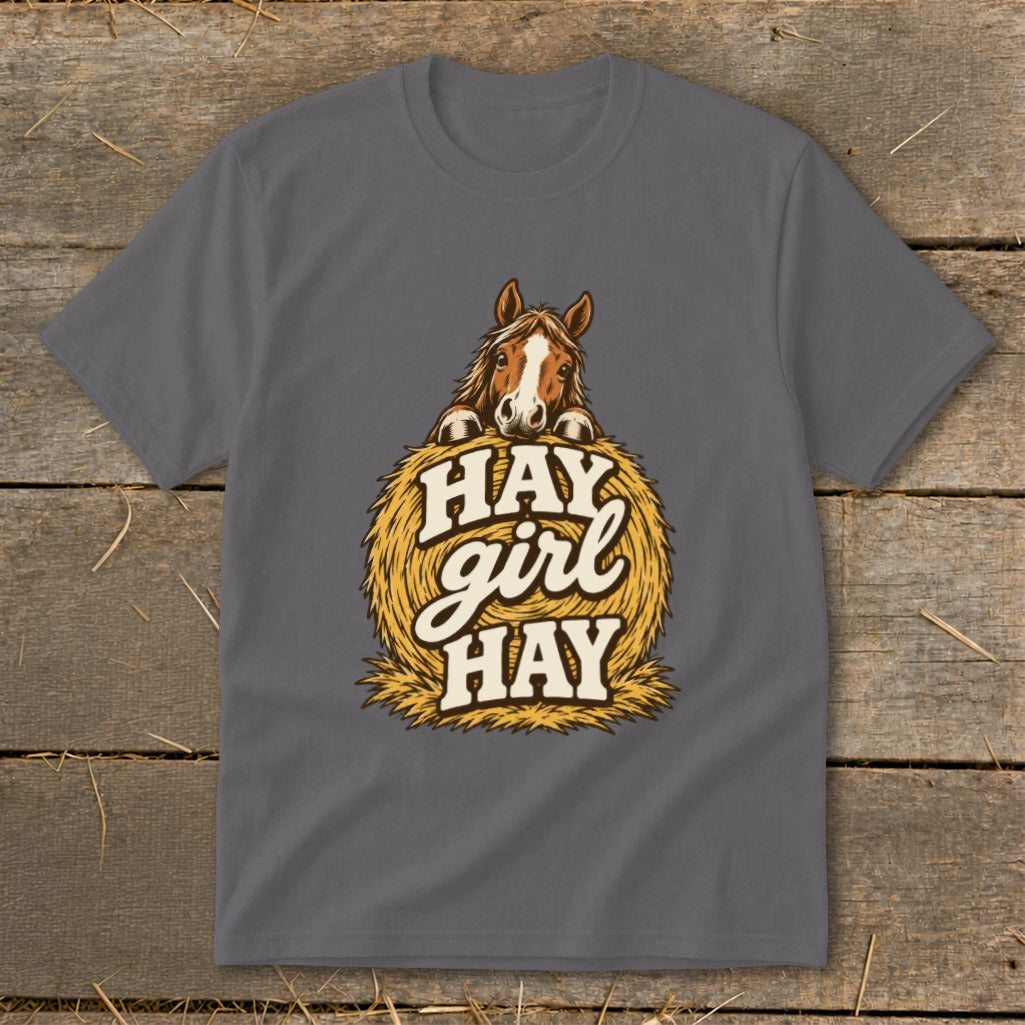 Grey t-shirt with a horse peeking over a hay bale with text "HAY girl HAY".