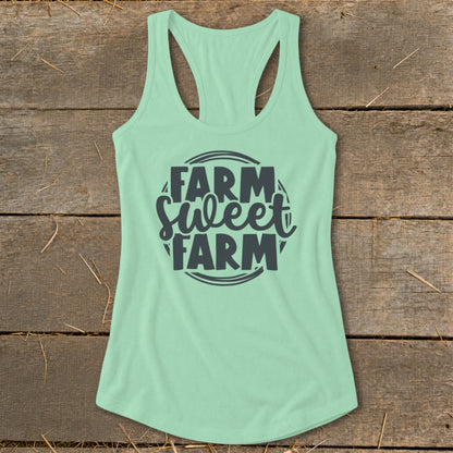 Mint green racerback tank top with "Farm Sweet Farm" text graphic.