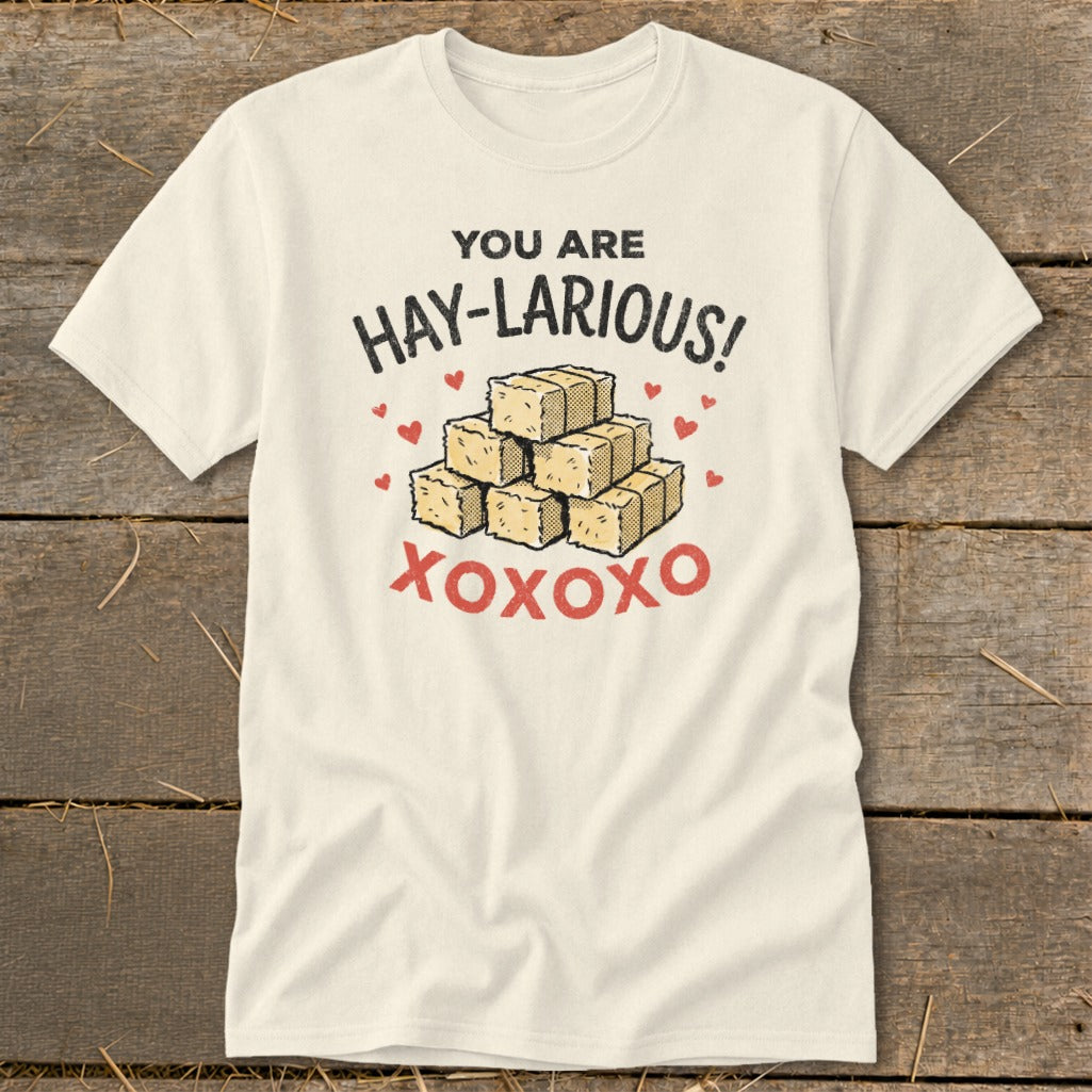 Cream t-shirt with "YOU ARE HAY-LARIOUS!" and bales of hay graphic.