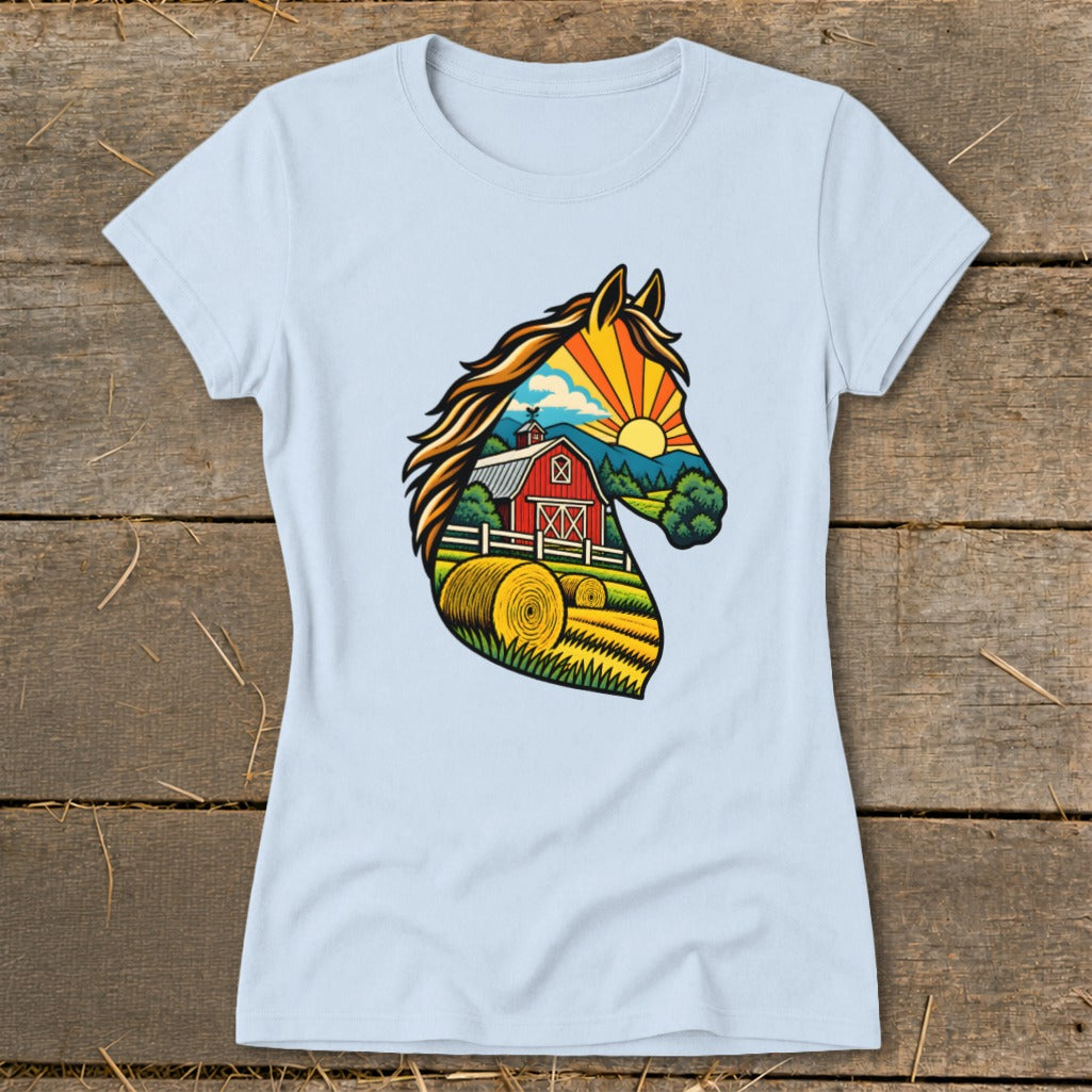 A light blue t-shirt with a colorful graphic of a horse profile framing a farm landscape.