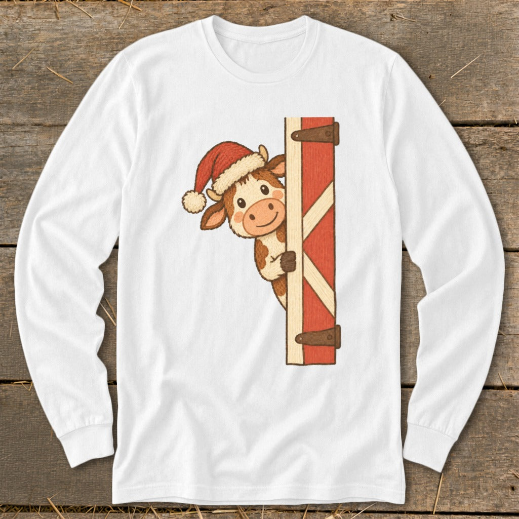 Cow wearing Santa hat peeking around a red barn door.