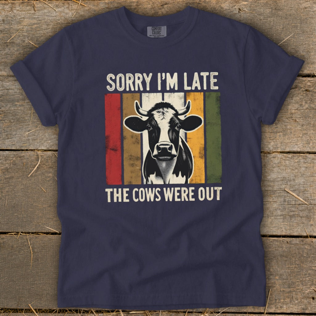 Navy t-shirt with "Sorry I'm Late The Cows Were Out" and a cow graphic.