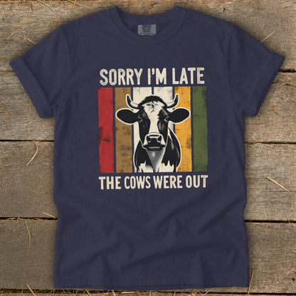 Navy t-shirt with "Sorry I'm Late The Cows Were Out" and a cow graphic.