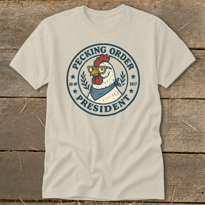 T-shirt with graphic of a chicken wearing glasses and bandana, text "Pecking Order President".
