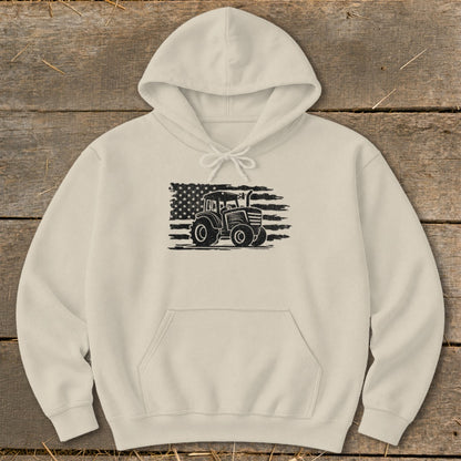 Tan hoodie with a black graphic of a tractor in front of a distressed American flag.