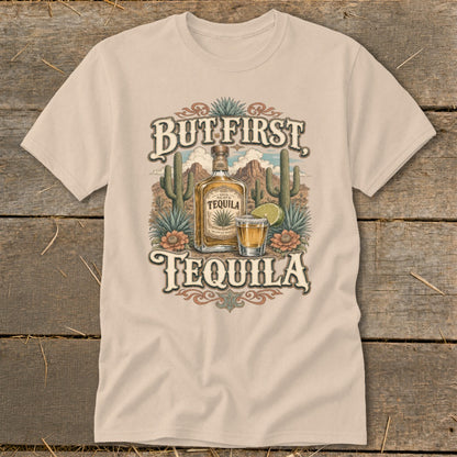 T-shirt with desert scene, bottle, shot glass, and text "But First Tequila".