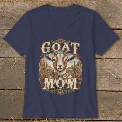 Goat Mom graphic with a goat, desert landscape, and floral accents on a navy shirt.