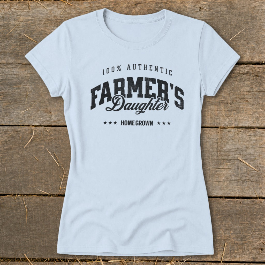 Light blue t-shirt with "100% AUTHENTIC FARMER'S DAUGHTER HOME GROWN" text.