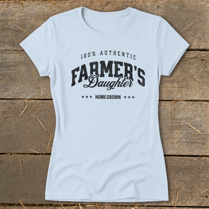 Light blue t-shirt with "100% AUTHENTIC FARMER'S DAUGHTER HOME GROWN" text.