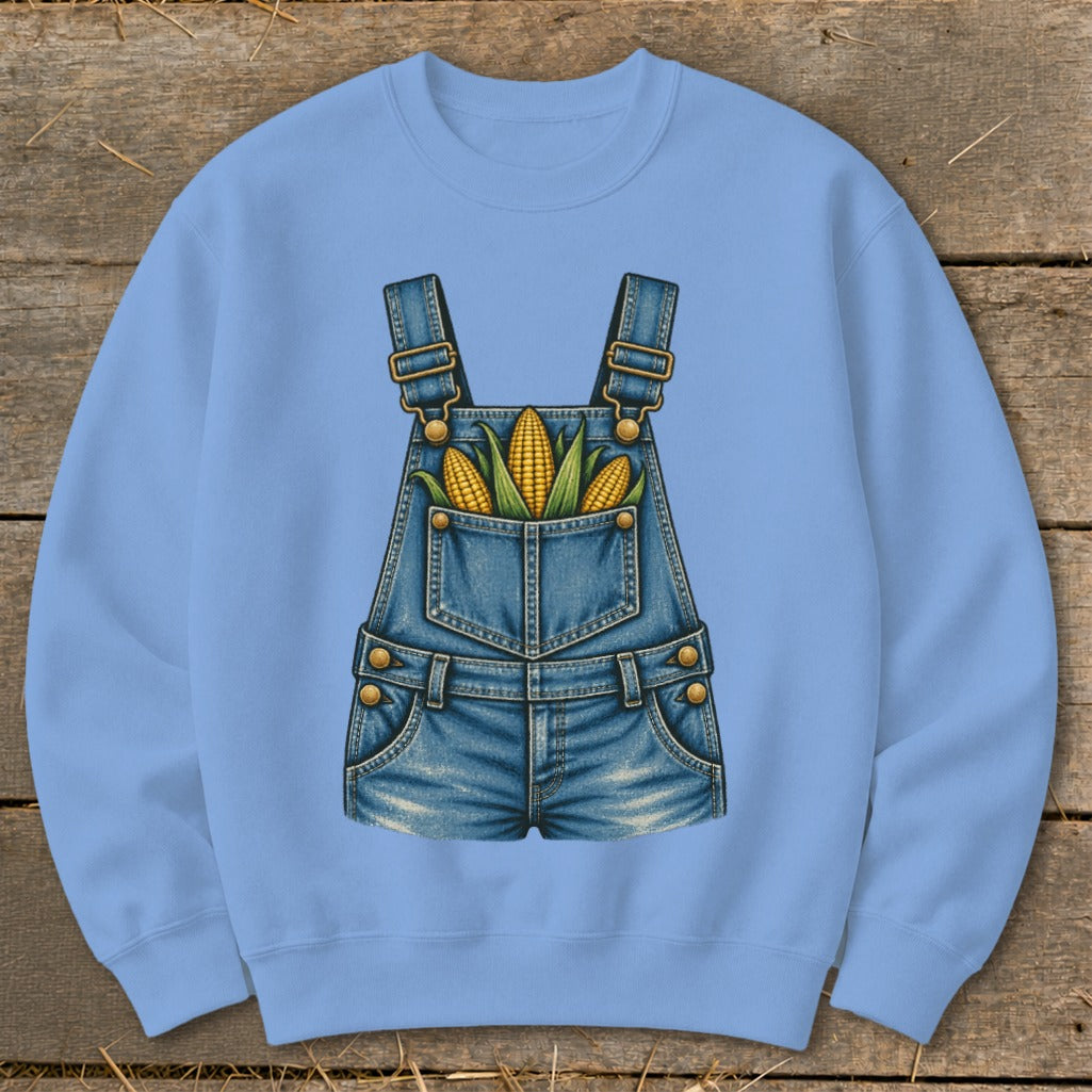 Light blue sweatshirt with a denim overalls graphic holding ears of corn.