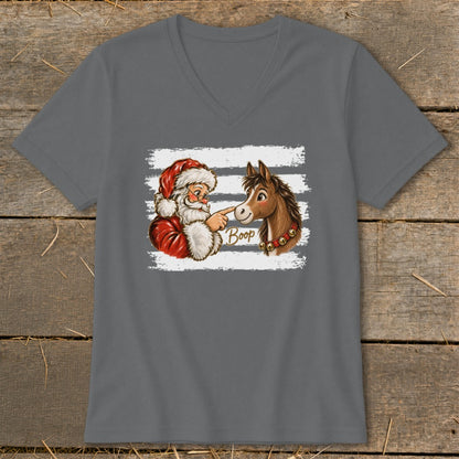 Santa booping a horse with the word "Boop" on a t-shirt.