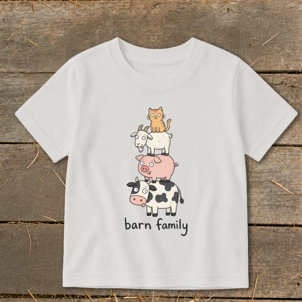 White t-shirt with cartoon animals stacked and text "barn family".