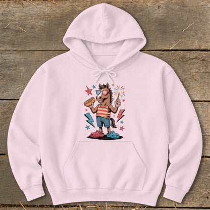 Horse wearing sunglasses, holding a hot dog and a sparkler, on a pink hoodie.