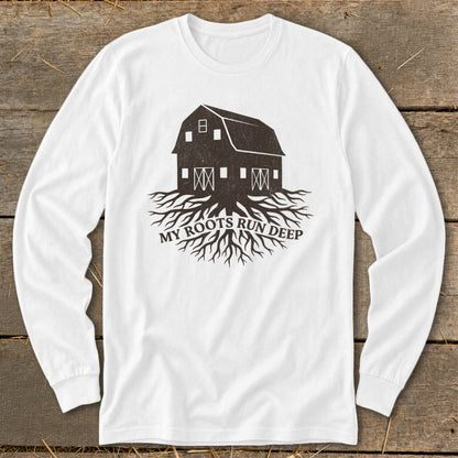 White long-sleeve shirt with a dark brown barn graphic and roots, reading "My Roots Run Deep".