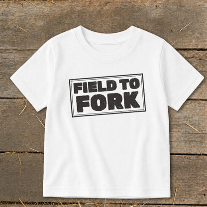 A white short-sleeved t-shirt featuring the black stamped text "FIELD TO FORK" centered on the chest.